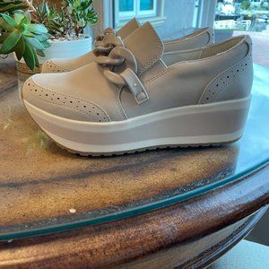 Dolce Vita Jhenee Slip on Wedge Sneakers with Chain Detail. Color Dune Suede.